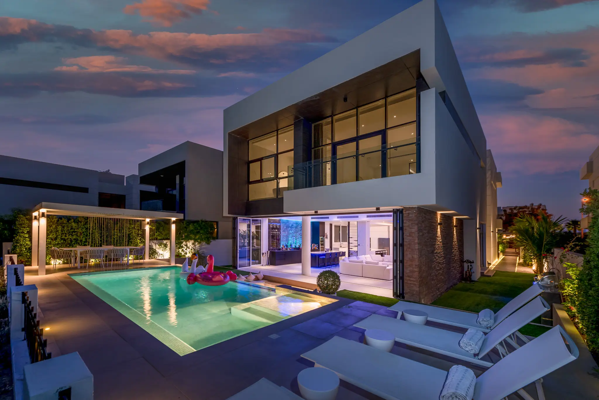 Modern villa exterior with smart lighting and automation